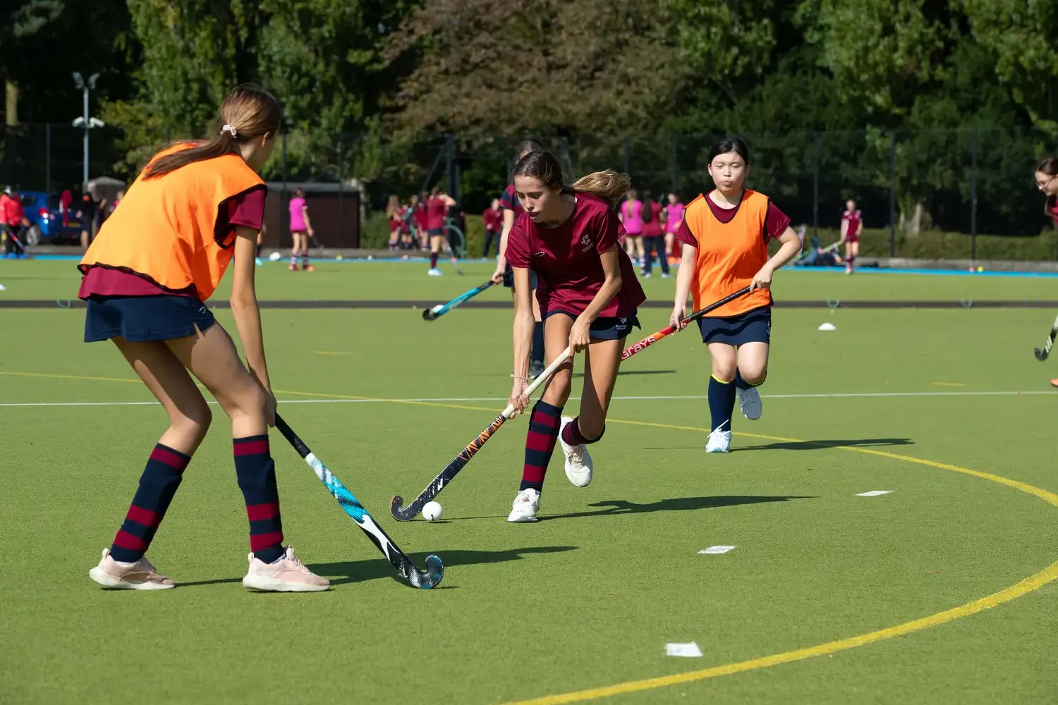 Boarding pupils playing hockey at Denstone College